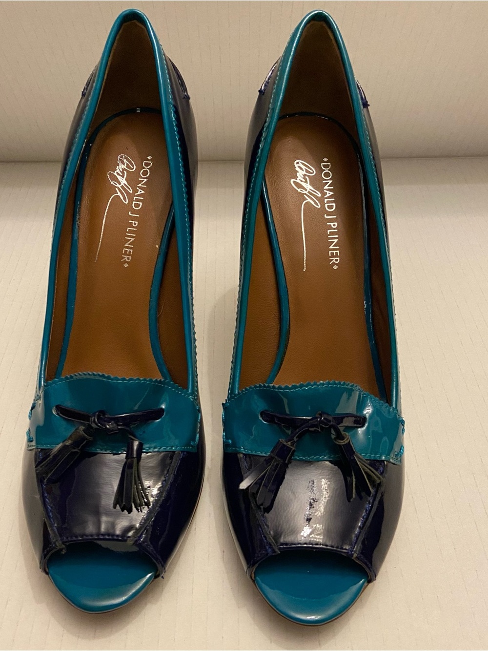 Donald J. Pliner Penni Tassel Color Block Navy and Teal Patent Peep-Toe Heels. - Picture 2 of 8